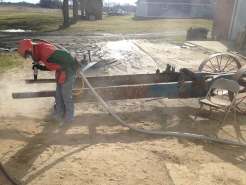 Nicholas sandblasting the frame